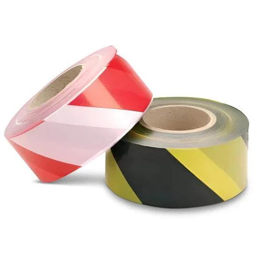 High-visibility adhesive hazard warning tape with bold chevron pattern for industrial safety marking
