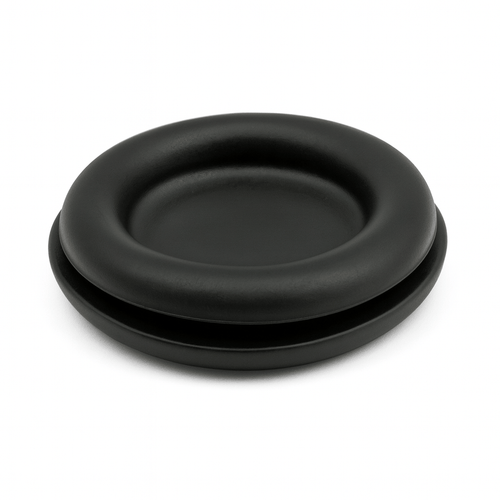 Blanking grommets installed in electrical panel sealing unused holes